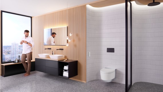 Mann in Geberit ONE Badezimmer mit Geberit AquaClean Mera und Geberit Option Plus Spiegel