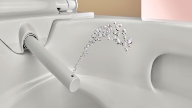 Toilet with cleaning function: shower spray of the Geberit AquaClean Alba shower toilet