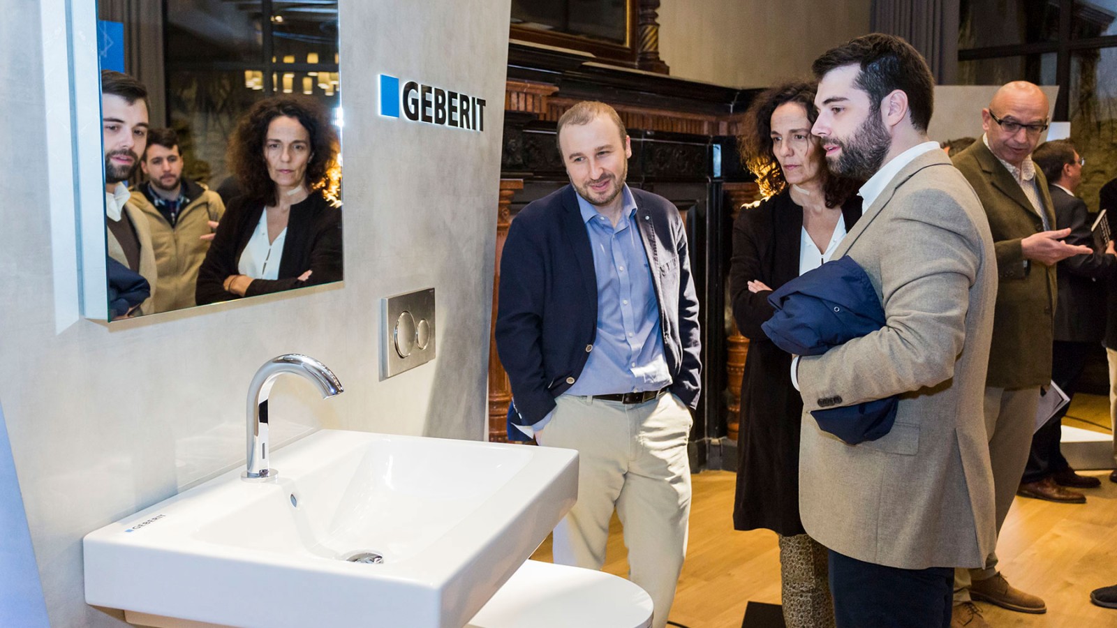 People in a Geberit showroom