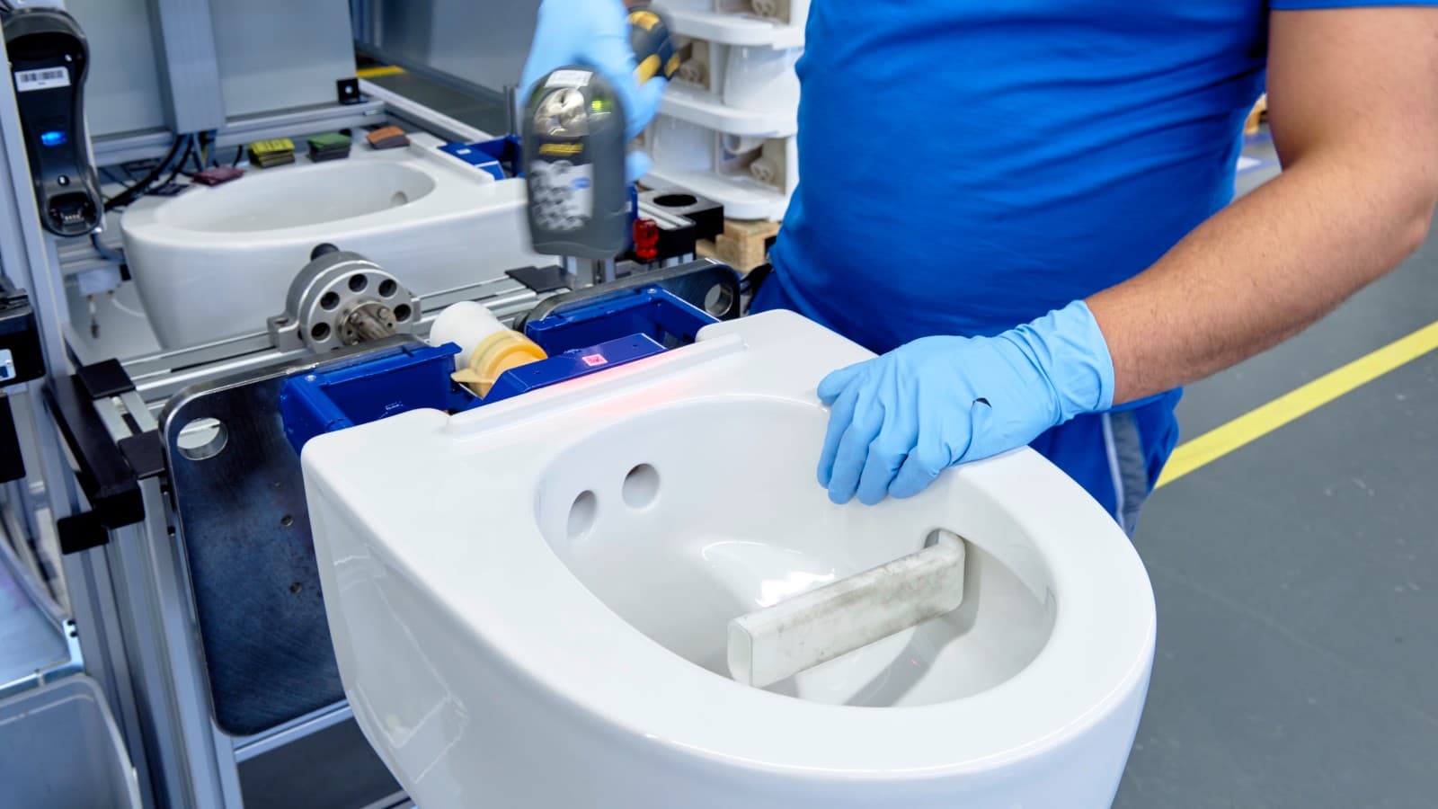 Geberit employee works on a Geberit AquaClean Mera shower toilet in Jona Geberit employee works on a Geberit AquaClean Mera shower toilet in Jona