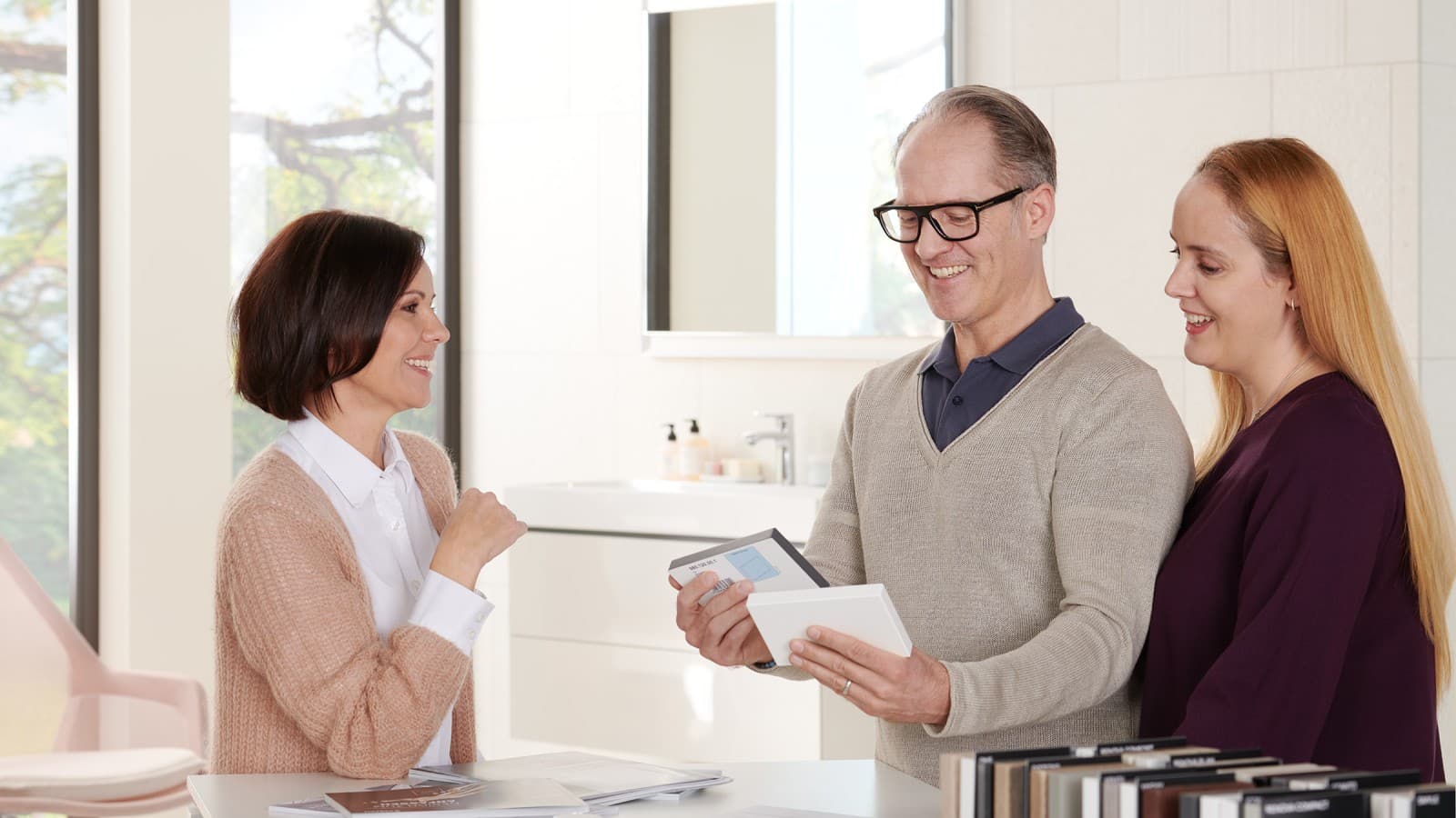 A specialist retailer advises a couple A specialist retailer advises a couple